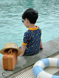 Bộ liền quần đùi bé trai cộc tay khủng long vàng