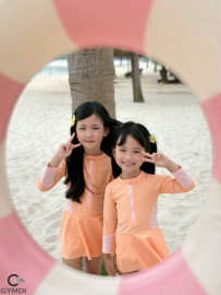 Bộ liền tay dài bé gái cam