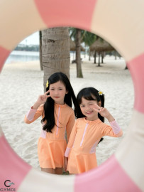 Bộ liền tay dài bé gái cam